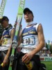 Janne Ahonen (Finlandia) oczekuje na dekorację po konkursie drużynowym; po lewej Matti Hautamaeki (Finlandia)